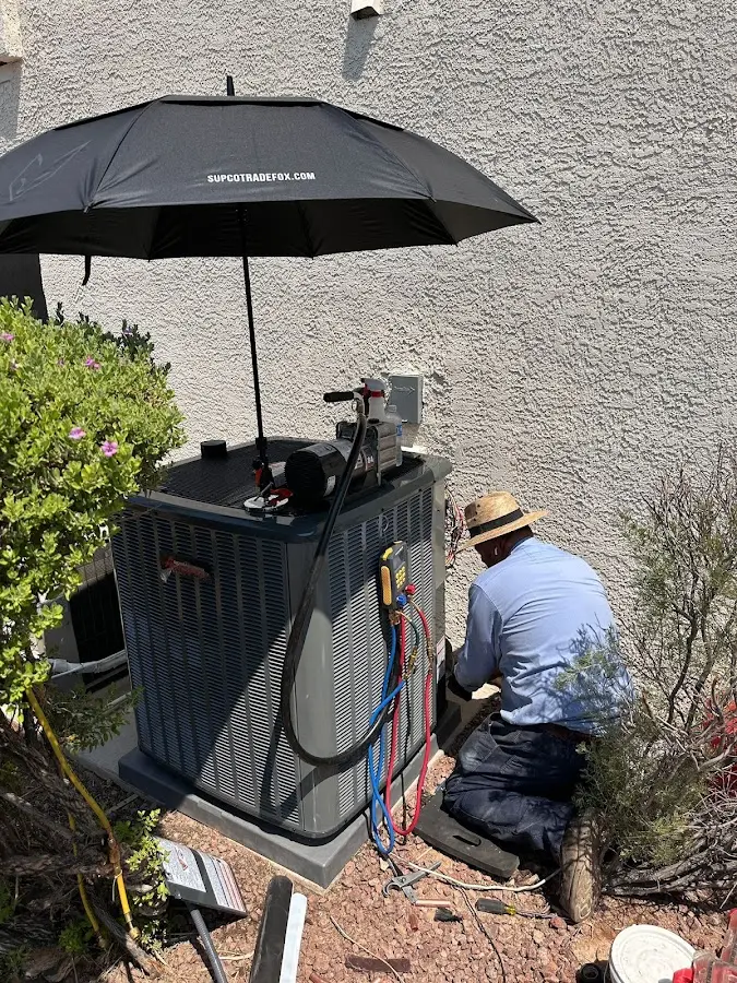 HVAC technician performing outdoor AC maintenance in Neptune Beach